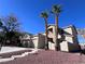 Two-story house with a two-car garage and red rock landscaping at 10488 Beckaville Ave, Las Vegas, NV 89129