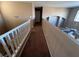 Upstairs hallway with carpet and white railings at 10488 Beckaville Ave, Las Vegas, NV 89129