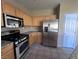 Kitchen with stainless steel appliances and granite countertops at 10488 Beckaville Ave, Las Vegas, NV 89129