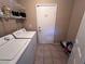 Laundry room with washer, dryer, and extra storage at 10488 Beckaville Ave, Las Vegas, NV 89129