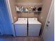 Laundry room with washer, dryer, and shelving at 10488 Beckaville Ave, Las Vegas, NV 89129