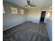 Spacious loft bedroom with carpet and ceiling fan at 10488 Beckaville Ave, Las Vegas, NV 89129