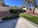 Artificial turf putting green in backyard with landscaping at 10488 Beckaville Ave, Las Vegas, NV 89129