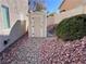 Small storage shed in backyard with gravel landscaping at 10488 Beckaville Ave, Las Vegas, NV 89129