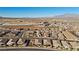 Aerial view of neighborhood with desert landscape at 10499 Skye Paseo Ave, Las Vegas, NV 89166