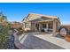 Outdoor entertaining area with patio, seating, and built-in grill at 10499 Skye Paseo Ave, Las Vegas, NV 89166