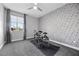 Bedroom with a drum set and geometric patterned wall at 10499 Skye Paseo Ave, Las Vegas, NV 89166