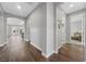 Bright hallway with hardwood floors and views into other rooms at 10499 Skye Paseo Ave, Las Vegas, NV 89166