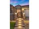 Front entry with lighted steps and decorative gate at 10499 Skye Paseo Ave, Las Vegas, NV 89166