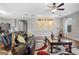 Elegant living room with hardwood floors, black leather furniture, and decorative art at 10499 Skye Paseo Ave, Las Vegas, NV 89166