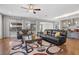 Relaxing living room features hardwood floors, leather sofas, and a large window at 10499 Skye Paseo Ave, Las Vegas, NV 89166