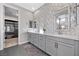 Main bathroom with double vanity, stylish tile work, and ample counter space at 10499 Skye Paseo Ave, Las Vegas, NV 89166