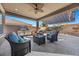 Relaxing patio with seating area, built-in grill, and retractable awning at 10499 Skye Paseo Ave, Las Vegas, NV 89166