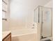 Bright bathroom featuring a soaking tub with a separate shower and a window with blinds at 11276 Accademia Ct, Las Vegas, NV 89141