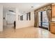 Open dining area with tile floors and backyard access through decorative curtains at 11276 Accademia Ct, Las Vegas, NV 89141