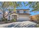 Charming two-story home with a well-maintained front yard and attached two car garage at 11276 Accademia Ct, Las Vegas, NV 89141