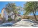 Two-story house with a driveway and landscaping in front at 11276 Accademia Ct, Las Vegas, NV 89141