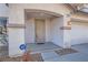 Inviting front entrance with covered porch and security system for added safety at 11276 Accademia Ct, Las Vegas, NV 89141