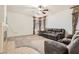 Cozy living room features plush seating, a fireplace, and soft carpet at 11276 Accademia Ct, Las Vegas, NV 89141