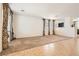 Spacious living room featuring carpet and tile flooring with lots of natural light at 11276 Accademia Ct, Las Vegas, NV 89141