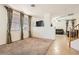 Bright living room with carpet and tile flooring, large windows and open view to the Gathering room at 11276 Accademia Ct, Las Vegas, NV 89141