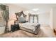 Spacious main bedroom with plush carpeting, decorative curtains and a king bed with a headboard at 11276 Accademia Ct, Las Vegas, NV 89141