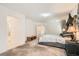 Spacious main bedroom with walk-in closet and soft carpeting with a king-sized bed and gray headboard at 11276 Accademia Ct, Las Vegas, NV 89141