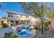 Beautiful backyard showcasing a sparkling pool and spa with a covered patio, perfect for outdoor entertaining at 11276 Accademia Ct, Las Vegas, NV 89141