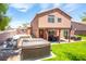 Spacious backyard with hot tub, patio cover, and built-in BBQ at 114 Appian Way, Henderson, NV 89002