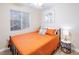 Bedroom with a double bed and orange bedding at 114 Appian Way, Henderson, NV 89002