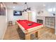 Game room boasts a pool table, fireplace, and built-in shelving at 114 Appian Way, Henderson, NV 89002