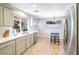 Updated kitchen with stainless steel appliances and light-grey cabinets at 114 Appian Way, Henderson, NV 89002