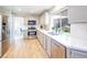 Modern kitchen with stainless steel appliances and light-grey cabinets at 114 Appian Way, Henderson, NV 89002