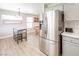 Kitchen features stainless steel appliances and breakfast nook area at 114 Appian Way, Henderson, NV 89002