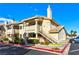 Attractive exterior of a two-story condo with stairs and landscaping at 1205 Sulphur Springs Ln # 101, Las Vegas, NV 89128