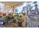 Charming condo patio with lush potted plants and gate at 1205 Sulphur Springs Ln # 101, Las Vegas, NV 89128