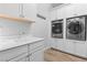 Bright laundry room with modern washer and dryer at 12169 Castilla Rain Ave, Las Vegas, NV 89138