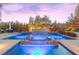 Resort-style backyard oasis with a large pool, spa, and water features at 12169 Castilla Rain Ave, Las Vegas, NV 89138