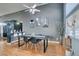 Dining area with a large table and chairs, hardwood floors, and gray walls at 1235 Pagentry Dr, North Las Vegas, NV 89031