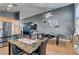 Kitchen dining area with granite topped table and four black chairs at 1235 Pagentry Dr, North Las Vegas, NV 89031