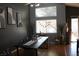 Dining area with a dark wood table and chairs, and decorative wall art at 1235 Pagentry Dr, North Las Vegas, NV 89031