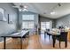 Open concept kitchen and dining area with hardwood floors and modern finishes at 1235 Pagentry Dr, North Las Vegas, NV 89031