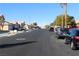 Residential street with parked cars and houses visible at 1235 Pagentry Dr, North Las Vegas, NV 89031