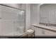 Modern bathroom with white vanity, glass shower, and a white color scheme, providing a clean and bright space at 129 Castanet Ln # Lot 190, Henderson, NV 89015