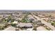 Bird's eye view of houses, streets, and surrounding desert landscape at 156 Ozuna Ct, Las Vegas, NV 89183