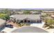 Aerial view of a single-Gathering home with a three-car garage and manicured lawn at 156 Ozuna Ct, Las Vegas, NV 89183