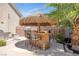 Tiki bar with seating, perfect for outdoor entertaining at 156 Ozuna Ct, Las Vegas, NV 89183