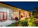 Evening view of backyard patio with seating and lighting at 156 Ozuna Ct, Las Vegas, NV 89183