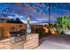 Outdoor kitchen and patio area with built-in grill at 156 Ozuna Ct, Las Vegas, NV 89183