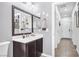 Clean bathroom with dark vanity and large mirror at 156 Ozuna Ct, Las Vegas, NV 89183